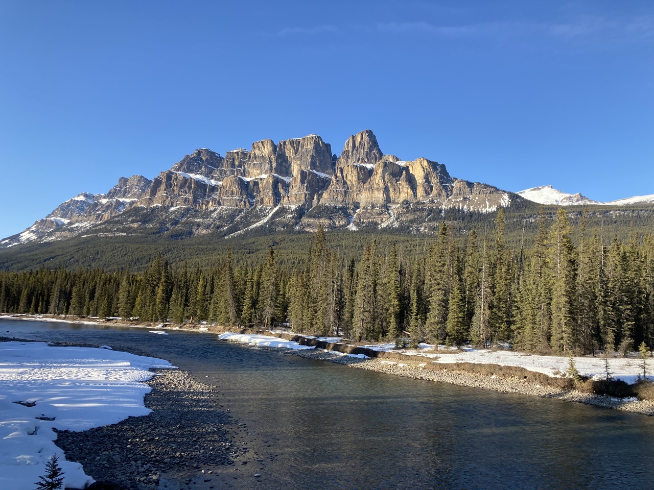 A view of Castle Mountain from the Bow River at a bridge crossing on Hwy 93, near the Bow Valley Parkway,